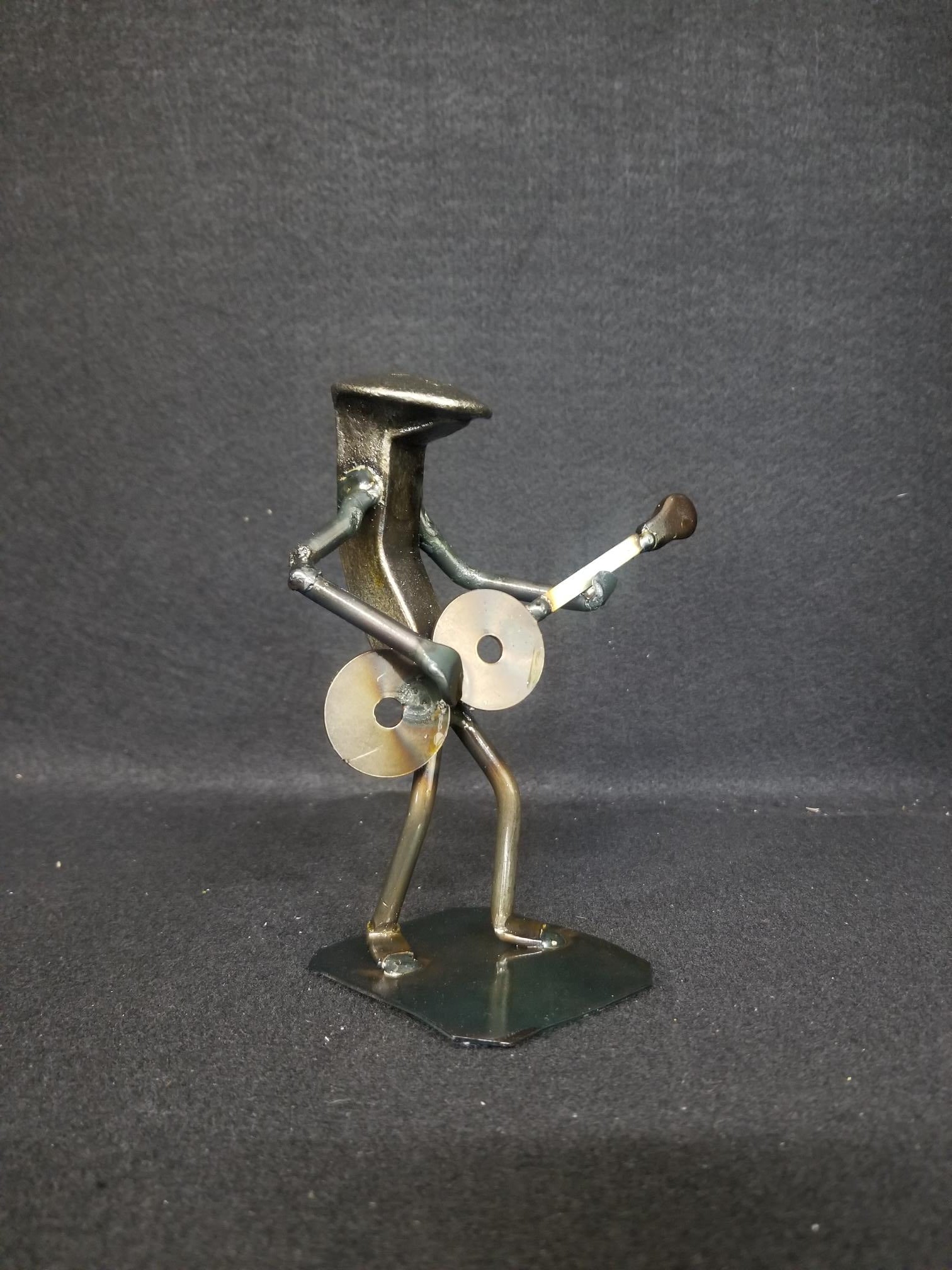 Guitar player holding guitar metal spike art product shot