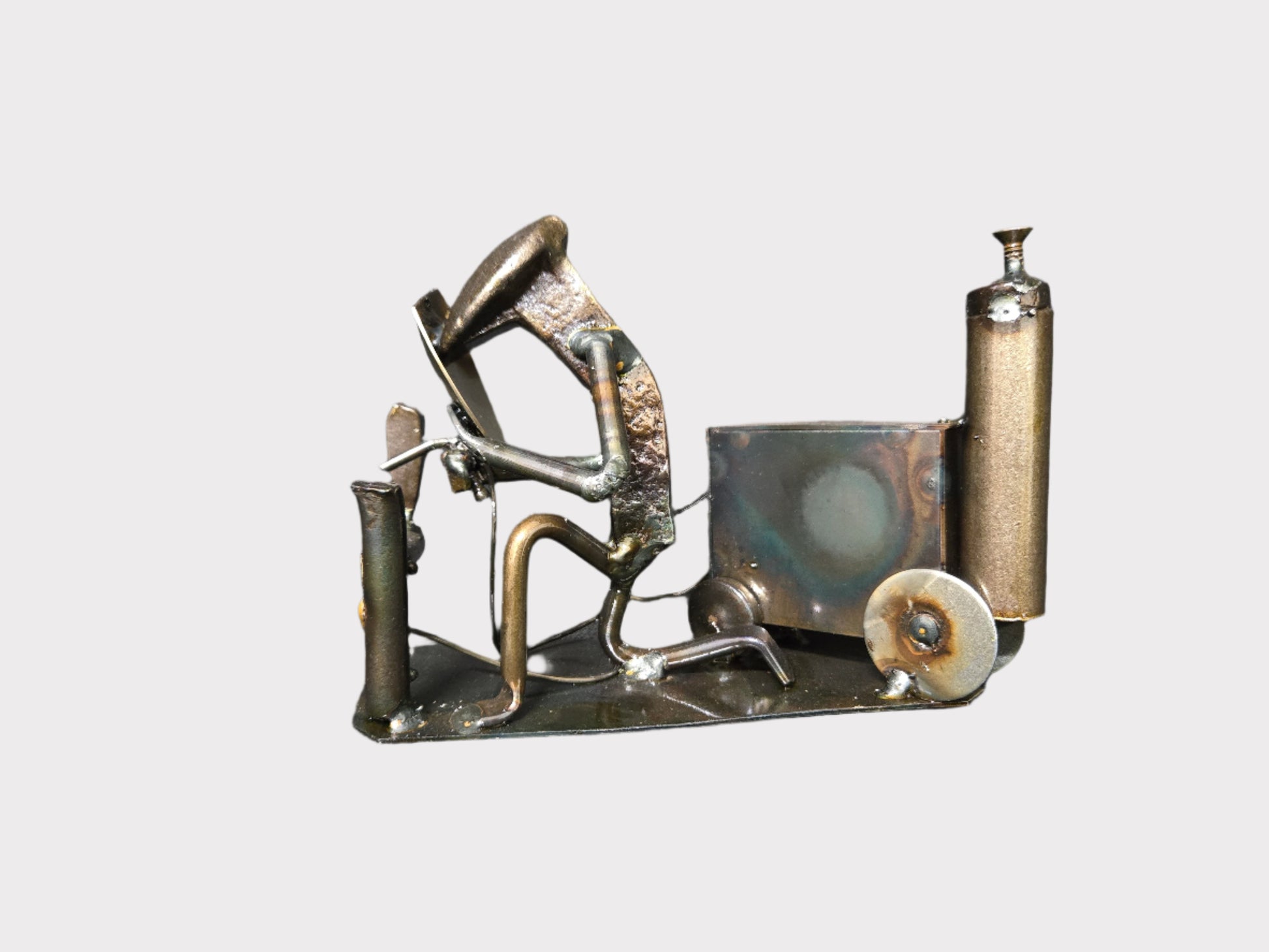 The Welder figure stands approximately 5-6 inches tall.