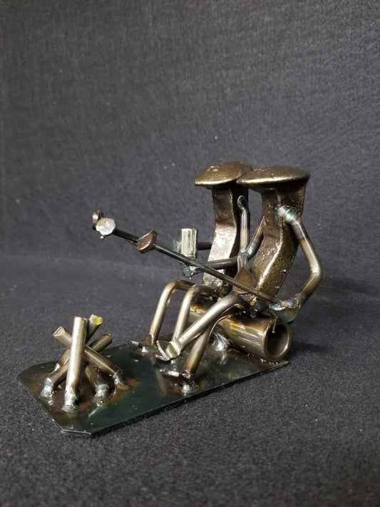 ORIGINAL: Two friends hanging out by the fire. It is very common for hand-held details on this figure to vary.
This figure is approximately 5 inches tall.