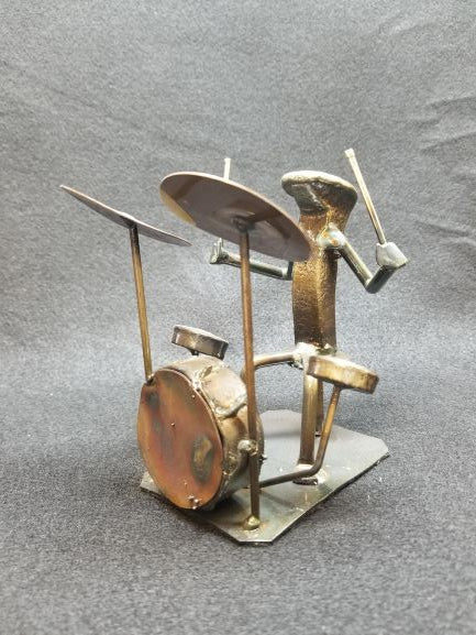 Drummer playing the drums metal spike art product photo