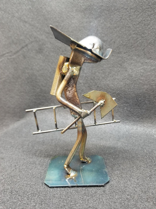 fireman holding a ladder and axe metal spike art product photo