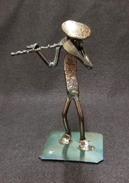 Musician holding flute up to mouth metal spike art product photo