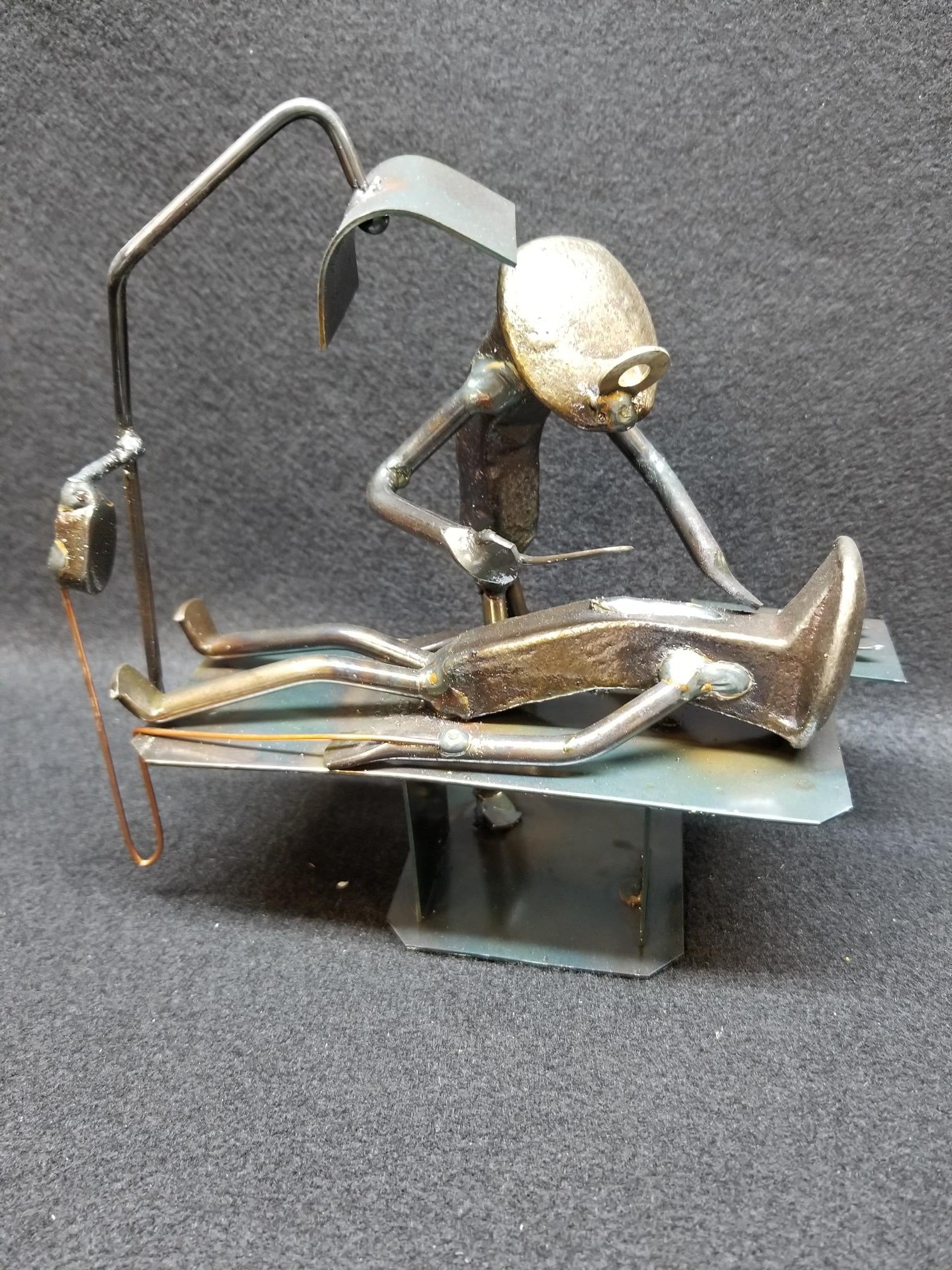 Heart Surgeon with patient on table metal spike art. STANDS APPROXIMATELY 7-8 INCHES HIGH.