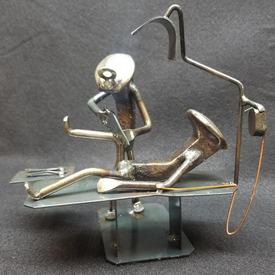 Knee Surgeon operating on a patient on table metal spike art