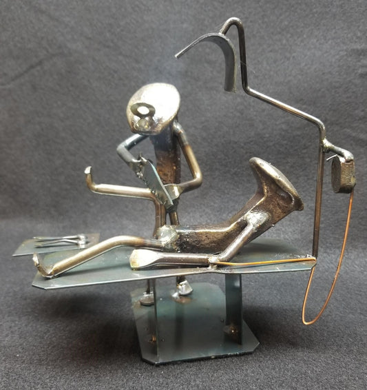 Knee Surgeon operating on a patient on table metal spike art