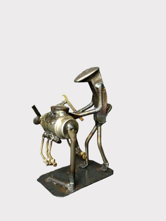 The Mechanic figure stands approximately 6 inches tall.