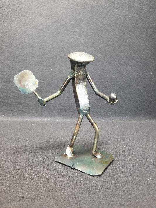 pickleball player holding paddle and ball metal spike art product photo
