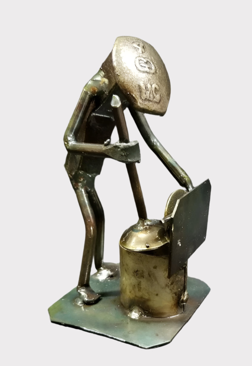 plumber with a plunger by the toilet metal spike art product photo