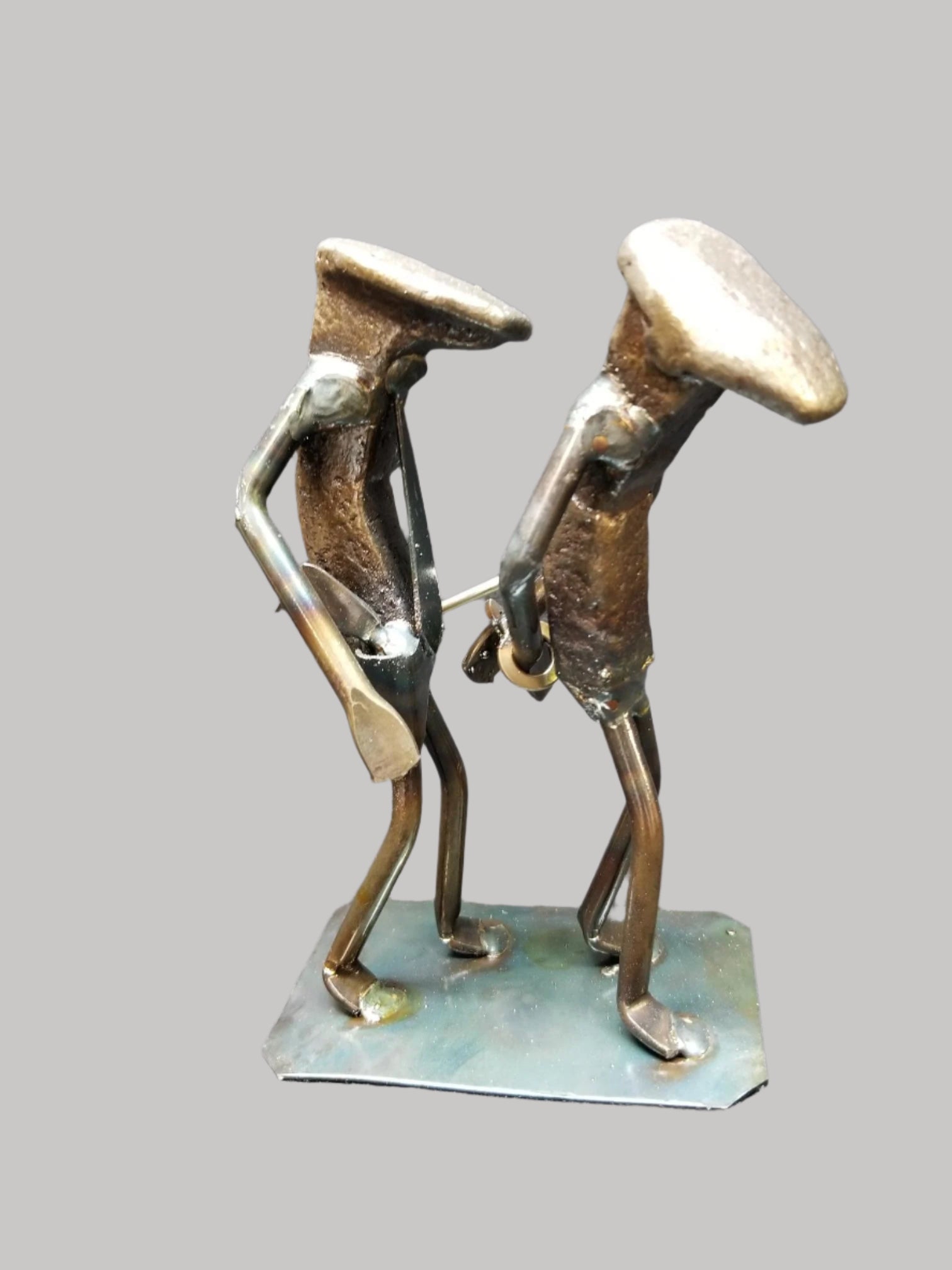 police officer standing near assailant in handcuffs metal spike art product photo