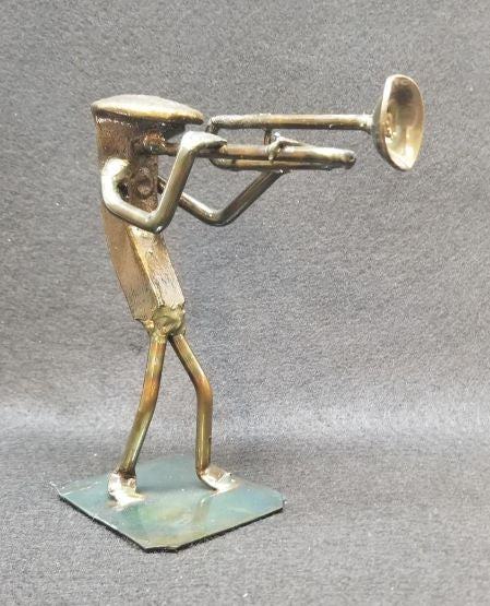 Musician playing the trombone standing metal spike art product photo