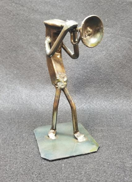 Trumpet musician with the trumpet in their hand metal spike art product photo