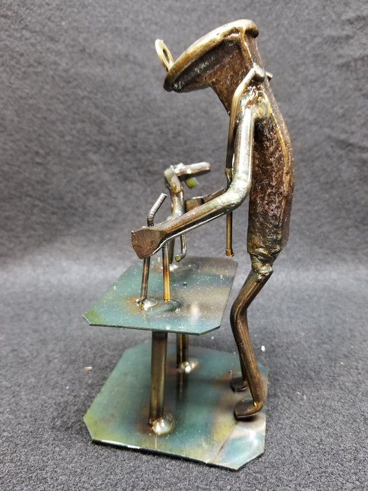 vet standing at table with dog ontop metal spike art product photo