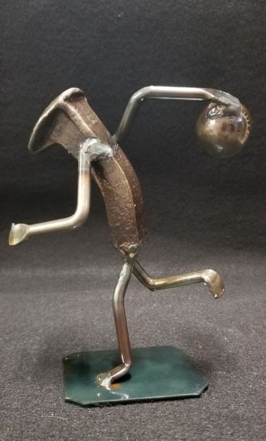 Bowler in midstance metal spike art product photo
