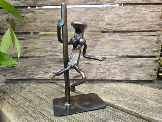 This figure stands 8-9 inches tall.