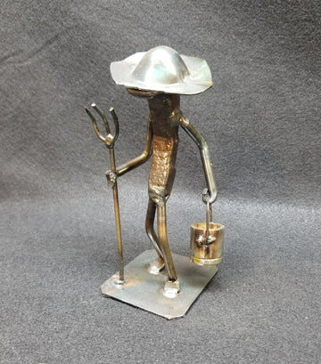 Farmer holding pitchfork metal spike art product photo