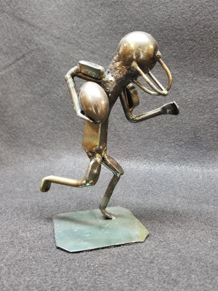 Football player running with football metal spike art product photo