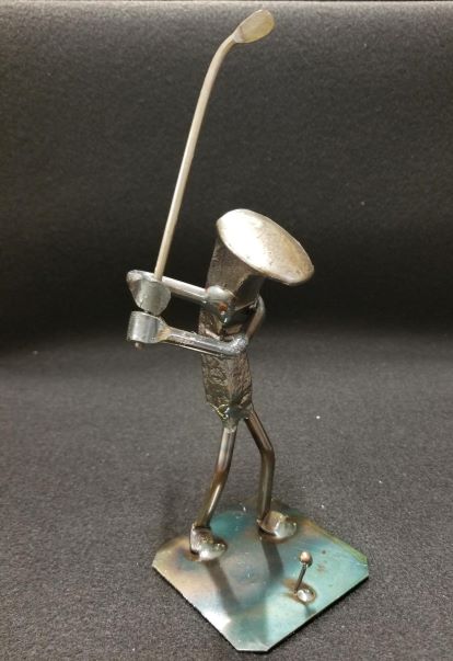 Golfer holding club in their backswing metal spike art product photo