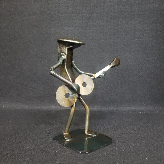 Guitar player holding guitar metal spike art product shot