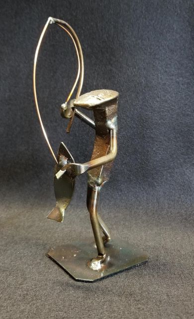 lunker action shot with rod and fish in hand metal spike art product photo