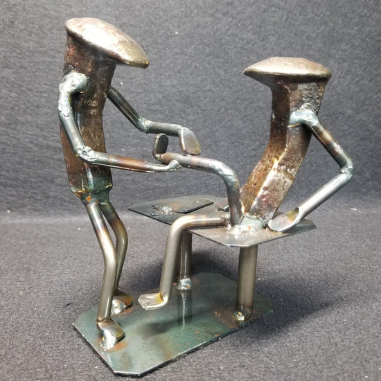 physical therapist inspecting a clients leg metal spike art product photo