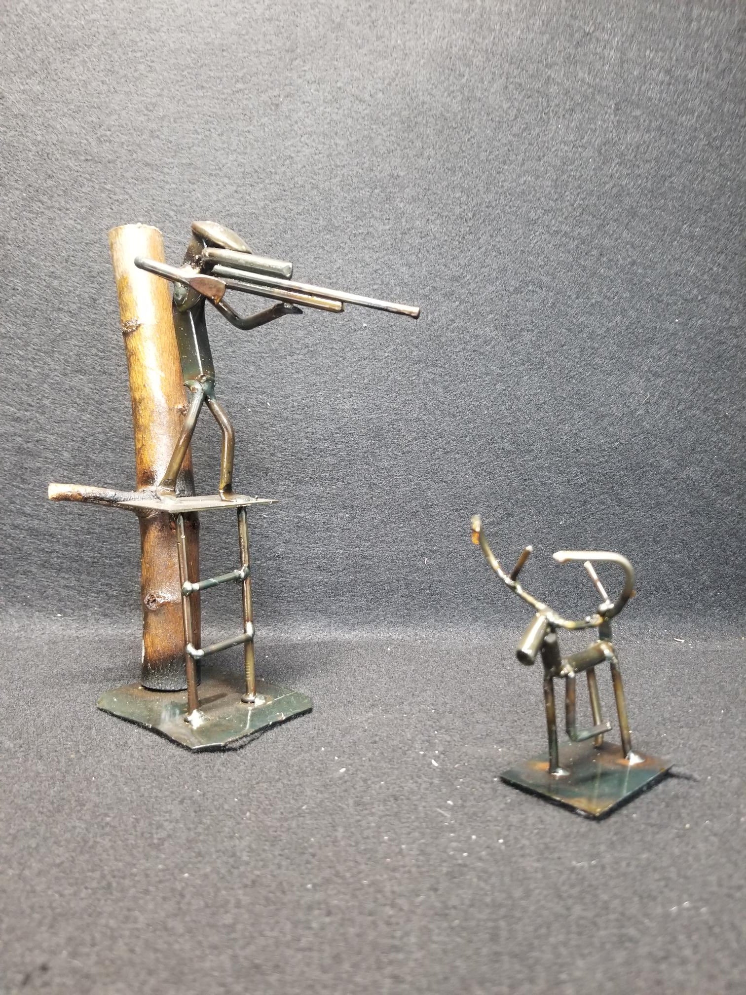 rifle hunter in tree stand metal spike art product photo