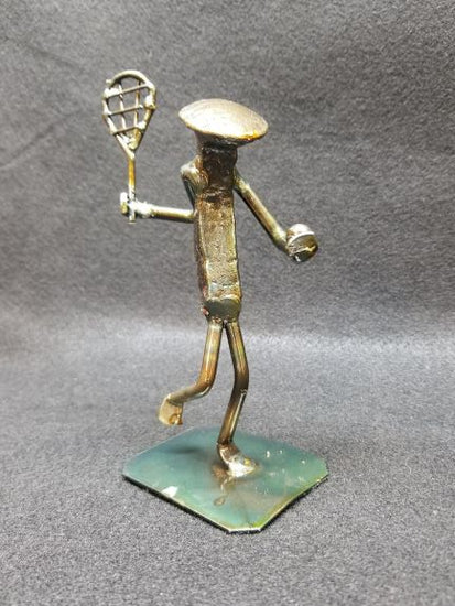 tennis player holding racket and ball metal spike art product photo