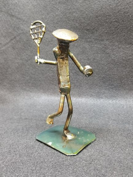 tennis player holding racket and ball metal spike art product photo