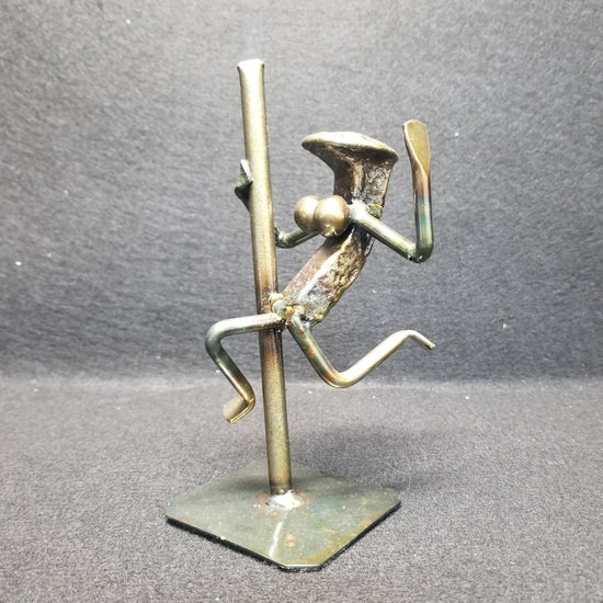 Exotic Dancer swinging with one hand on the pole metal spike art product photo