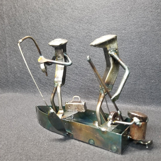 Fishing boat with two fishermen inside metal spike art product photo