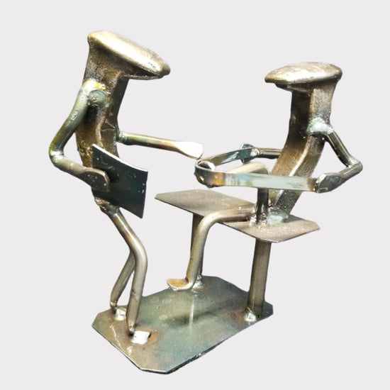 physical therapist with patient pressing a band with their foot metal spike art product photo